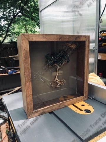 Wire tree artwork displayed inside a wooden shadowbox.