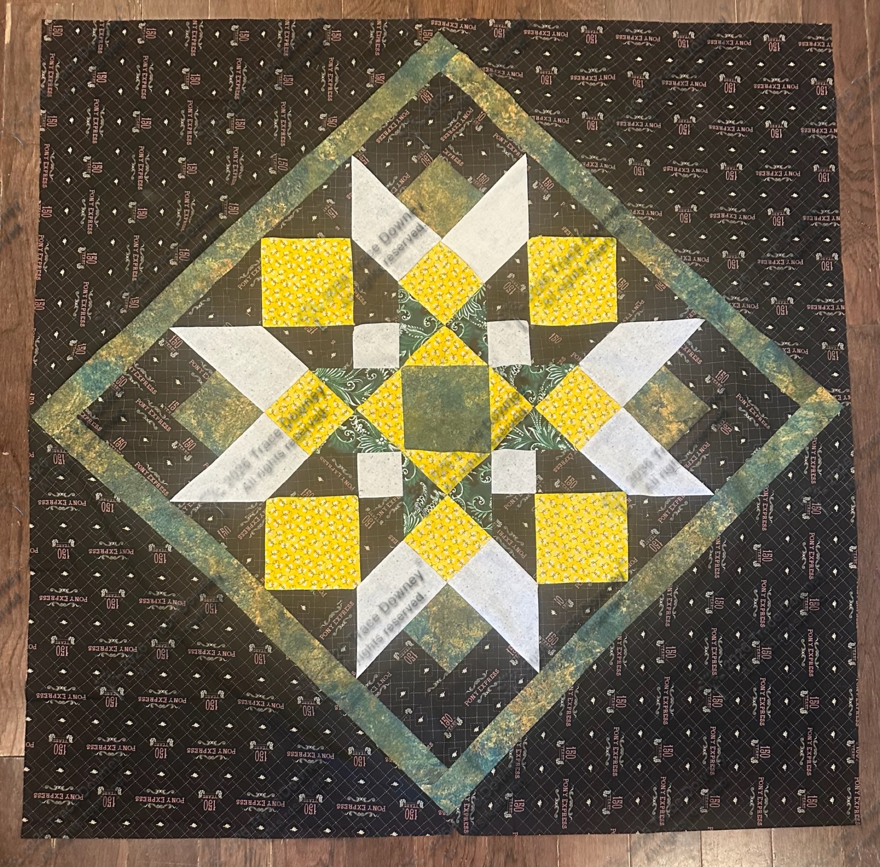 Square quilt block study with a dark ground and a central star motif.
